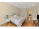 Spacious main bedroom features wood floors and ensuite bathroom at 4957 Sabal Lake Cir, Sarasota, FL 34238