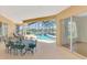 A lovely patio area overlooking a private pool and tranquil lake view for outdoor enjoyment at 4957 Sabal Lake Cir, Sarasota, FL 34238