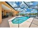 Inviting pool and spa with a covered lanai, perfect for enjoying outdoor living and relaxation at 4957 Sabal Lake Cir, Sarasota, FL 34238