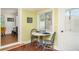 Charming dining area with a small table, chairs, and window offering natural light and a cozy atmosphere at 509 Pine Ave # A, Anna Maria, FL 34216