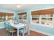 Charming dining room with terracotta tile flooring and ample natural light at 509 Pine Ave # A, Anna Maria, FL 34216