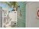 Exterior view of laundry area with 'Cottage Only' sign, and an anchor decoration at 509 Pine Ave # A, Anna Maria, FL 34216