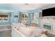 Bright living area with large windows, comfortable seating, and stylish accents at 509 Pine Ave # A, Anna Maria, FL 34216