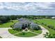 Beautiful home boasts lush landscaping, a circular driveway, and well-maintained grounds, providing a serene living experience at 520 Rye Ne Rd, Bradenton, FL 34212