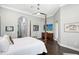 Bright bedroom boasts a four poster bed, dark floors, and neutral paint at 520 Rye Ne Rd, Bradenton, FL 34212