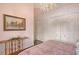 Cozy bedroom featuring a large bed, painting, chandelier and closet at 520 Rye Ne Rd, Bradenton, FL 34212