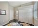 Bedroom featuring dark floors and a view into the bathroom and closets at 520 Rye Ne Rd, Bradenton, FL 34212