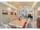 Dining room with a view into the living area, featuring a grand piano and fireplace at 520 Rye Ne Rd, Bradenton, FL 34212