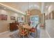 Elegant dining room featuring a modern chandelier, neutral color palette and glass doors to the outside at 520 Rye Ne Rd, Bradenton, FL 34212