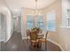 Charming dining area featuring a chandelier and a circular table with a flower centerpiece at 520 Rye Ne Rd, Bradenton, FL 34212