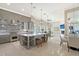 Open-concept kitchen features a center island, stone accent wall and stainless steel appliances at 520 Rye Ne Rd, Bradenton, FL 34212
