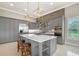 Modern kitchen features a center island, stainless appliances and a window for natural light at 520 Rye Ne Rd, Bradenton, FL 34212