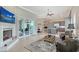 Spacious living room boasts a fireplace, tile floors, and seamless access to the outdoor living area at 520 Rye Ne Rd, Bradenton, FL 34212