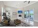 Bright living room features a fireplace, access to the lanai and comfortable seating at 520 Rye Ne Rd, Bradenton, FL 34212