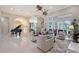 Open concept living space with elegant furnishings, a piano, and expansive windows providing ample natural light at 520 Rye Ne Rd, Bradenton, FL 34212