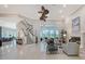 Bright living room with a fireplace, high ceilings, and access to an outdoor patio through sliding glass doors at 520 Rye Ne Rd, Bradenton, FL 34212