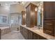 Spacious bathroom featuring a glass-enclosed shower, soaking tub, and double vanity with granite countertops at 520 Rye Ne Rd, Bradenton, FL 34212