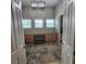 Bright office with built-in desk, storage cabinets, modern chandelier, and colorful area rug at 520 Rye Ne Rd, Bradenton, FL 34212