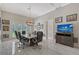 Bright office features a large meeting table, natural light, and a modern chandelier at 520 Rye Ne Rd, Bradenton, FL 34212