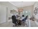 Bright office features a large meeting table, natural light, and access to the outdoor living area at 520 Rye Ne Rd, Bradenton, FL 34212