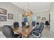 Bright office features a large meeting table, natural light, and a statement light fixture at 520 Rye Ne Rd, Bradenton, FL 34212