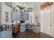 Bright office with vaulted ceilings, dark wood floors, built-in cabinets and desk at 520 Rye Ne Rd, Bradenton, FL 34212
