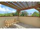 Covered porch features a wood porch swing and a wood-covered pergola at 520 Rye Ne Rd, Bradenton, FL 34212