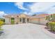 Gorgeous home featuring a three-car garage, tile roof, and beautiful landscaping at 5523 Secluded Oaks Way, Sarasota, FL 34233
