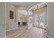 Inviting foyer featuring tiled floors, decorative arches, and elegant lighting fixtures at 5523 Secluded Oaks Way, Sarasota, FL 34233