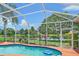 A private pool and scenic backyard enhance outdoor living, perfect for relaxation and recreation at 5523 Secluded Oaks Way, Sarasota, FL 34233