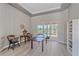 Spacious sitting room with tile floors and sliding doors leading to the pool at 5523 Secluded Oaks Way, Sarasota, FL 34233