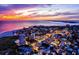 Stunning aerial view of a coastal community at sunset with vibrant skies and city lights at 5600 Beach Way Dr # 315, Sarasota, FL 34242