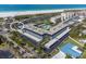 Stunning aerial view of the condo complex with a pool and beach access in a tropical community at 5600 Beach Way Dr # 315, Sarasota, FL 34242