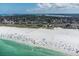 Breathtaking aerial shot of a beach with soft sand and crystal-clear turquoise water at 5600 Beach Way Dr # 315, Sarasota, FL 34242