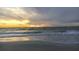 Picturesque beach scene with a tranquil ocean view during a beautiful sunset at 5600 Beach Way Dr # 315, Sarasota, FL 34242
