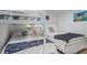 Shared bedroom featuring bunk beds and a full bed, great for  at 5600 Beach Way Dr # 315, Sarasota, FL 34242