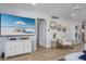 Coastal living room features a decorative media console and stylish gold accents at 5600 Beach Way Dr # 315, Sarasota, FL 34242