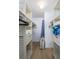 Spacious walk-in closet with built-in shelving and ample storage space at 5600 Beach Way Dr # 315, Sarasota, FL 34242
