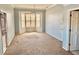Bedroom featuring neutral carpeting, bay windows with shutter, and ample natural light at 5615 Waneta Pl, Sarasota, FL 34231