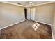 Bedroom featuring neutral walls, brown carpet, ceiling fan, and a closet at 5615 Waneta Pl, Sarasota, FL 34231