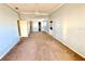 Bright bedroom with plush carpeting, ceiling fan, and multiple entry doors at 5615 Waneta Pl, Sarasota, FL 34231