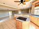 Spacious kitchen with cooktop island, generous counter space, and open flow to living areas at 5615 Waneta Pl, Sarasota, FL 34231