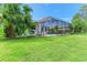 Beautiful backyard featuring a screened pool area and lush landscaping at 6423 Royal Tern Cir, Lakewood Ranch, FL 34202