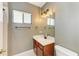 This bathroom features a single vanity, window, and modern lighting at 6423 Royal Tern Cir, Lakewood Ranch, FL 34202