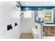 Contemporary bathroom features white tiled walls, and a rainfall shower head at 6423 Royal Tern Cir, Lakewood Ranch, FL 34202