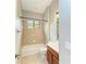 Full bathroom featuring a shower-tub combo and wood vanity at 6423 Royal Tern Cir, Lakewood Ranch, FL 34202