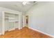 Bedroom features hardwood floors and closet at 6423 Royal Tern Cir, Lakewood Ranch, FL 34202