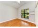 Bright bedroom with hardwood floors, large window, and ceiling fan at 6423 Royal Tern Cir, Lakewood Ranch, FL 34202