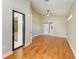 Spacious bedroom with hardwood floors, a sliding glass door, and a vaulted ceiling with fan at 6423 Royal Tern Cir, Lakewood Ranch, FL 34202