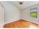 Bright bedroom with hardwood floors, natural light, and neutral paint at 6423 Royal Tern Cir, Lakewood Ranch, FL 34202